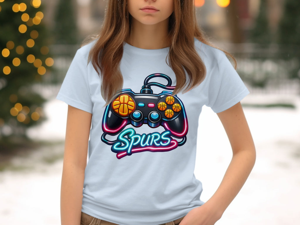 Light blue t-shirt with a neon video game controller and "Spurs" text.