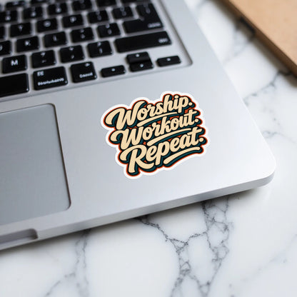 Sticker with text "Worship. Workout. Repeat." on a laptop.
