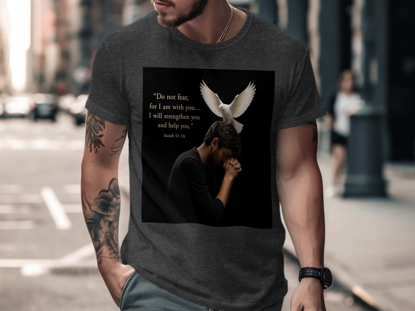 Dark t-shirt with a man praying and a dove, featuring Isaiah 41:10 text.