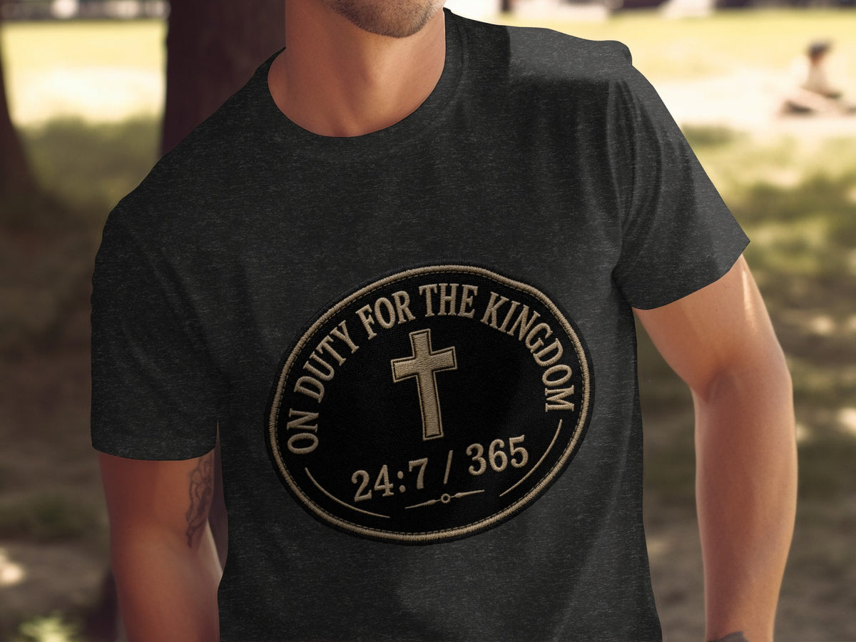 Dark gray t-shirt with oval emblem featuring a cross and "ON DUTY FOR THE KINGDOM 24:7 / 365" text.