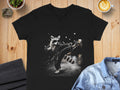 Black v-neck t-shirt graphic of a raccoon doing a karate kick.