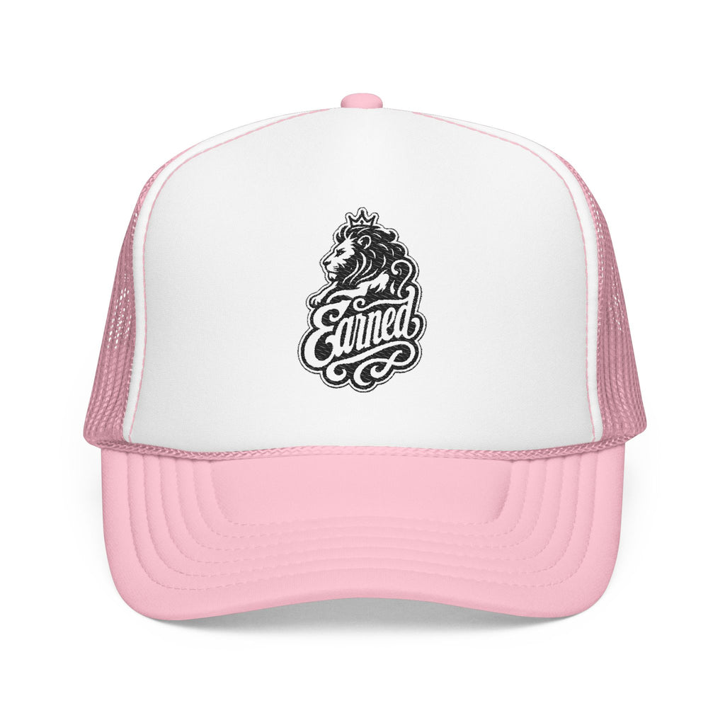 Pink trucker hat with embroidered lion wearing crown and "Earned" text.