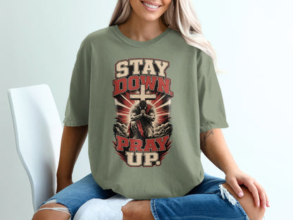 T-shirt with "Stay Down Pray Up" text, a kneeling figure, and a cross.