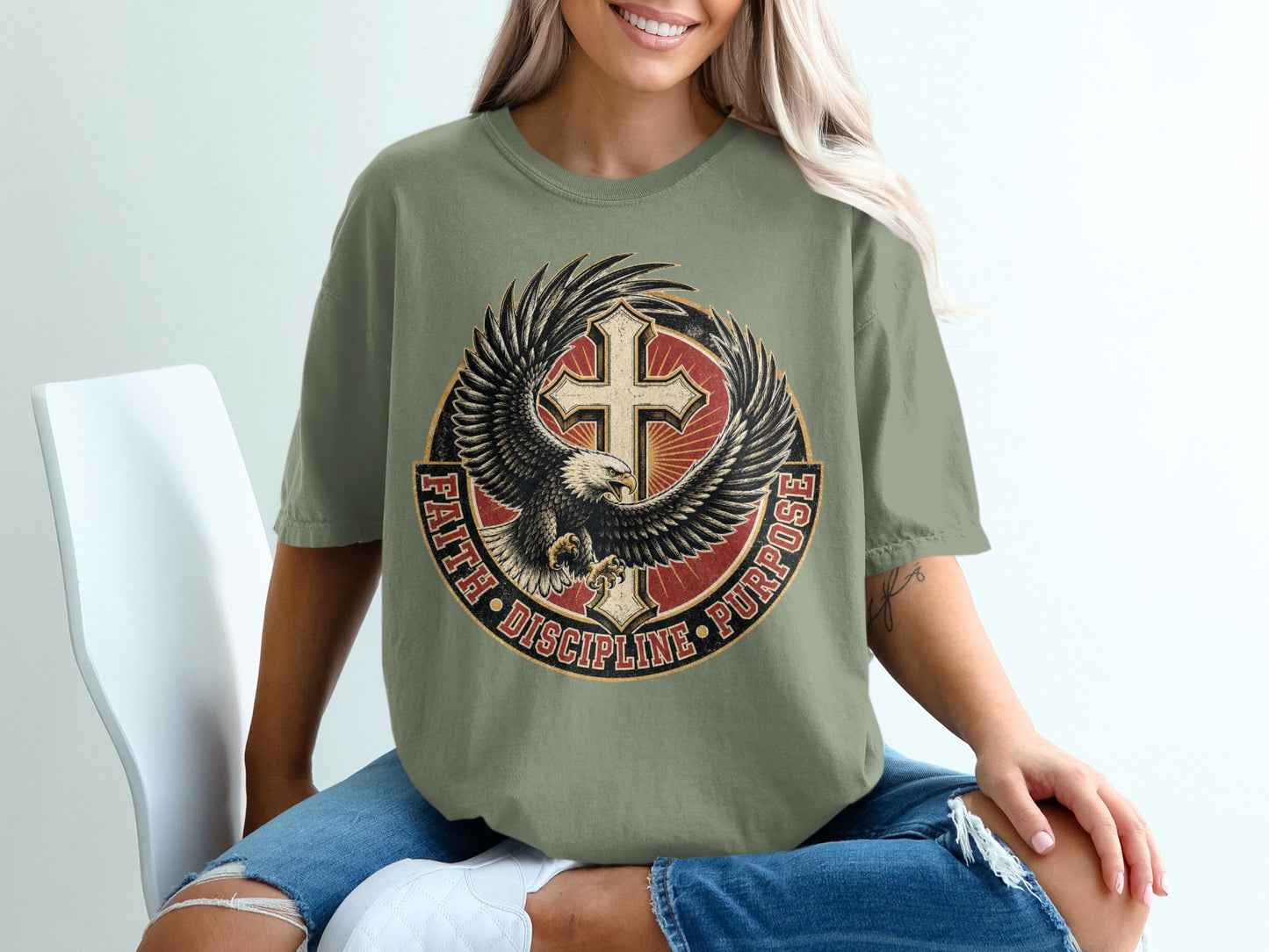 Green t-shirt with eagle, cross, and "FAITH DISCIPLINE PURPOSE" text.