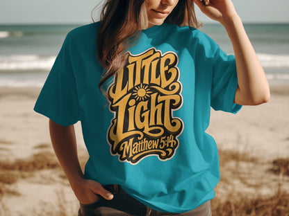 Teal t-shirt with yellow "Little Light Matthew 5:14" text and sun graphic.