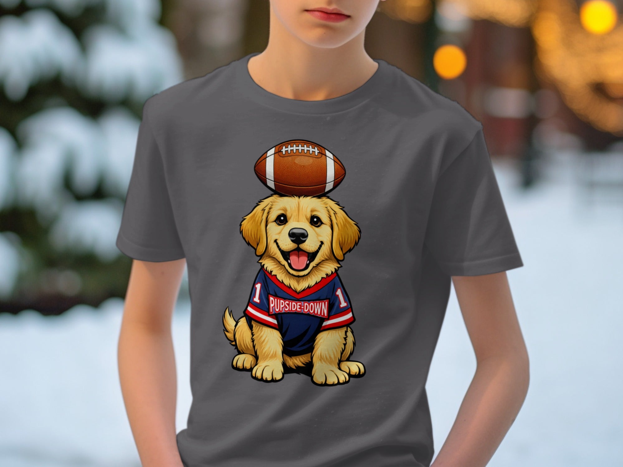 Golden retriever puppy wearing football jersey with "PUPSIDE-DOWN" text, football on head.