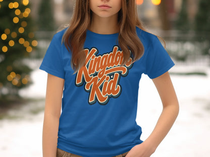 Blue t-shirt with "Kingdom Kid" text in orange and cream script.