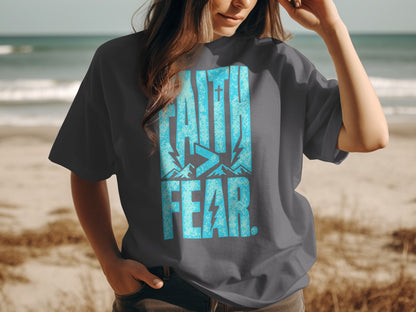 Dark grey t-shirt with "FAITH>FEAR." graphic in distressed blue.