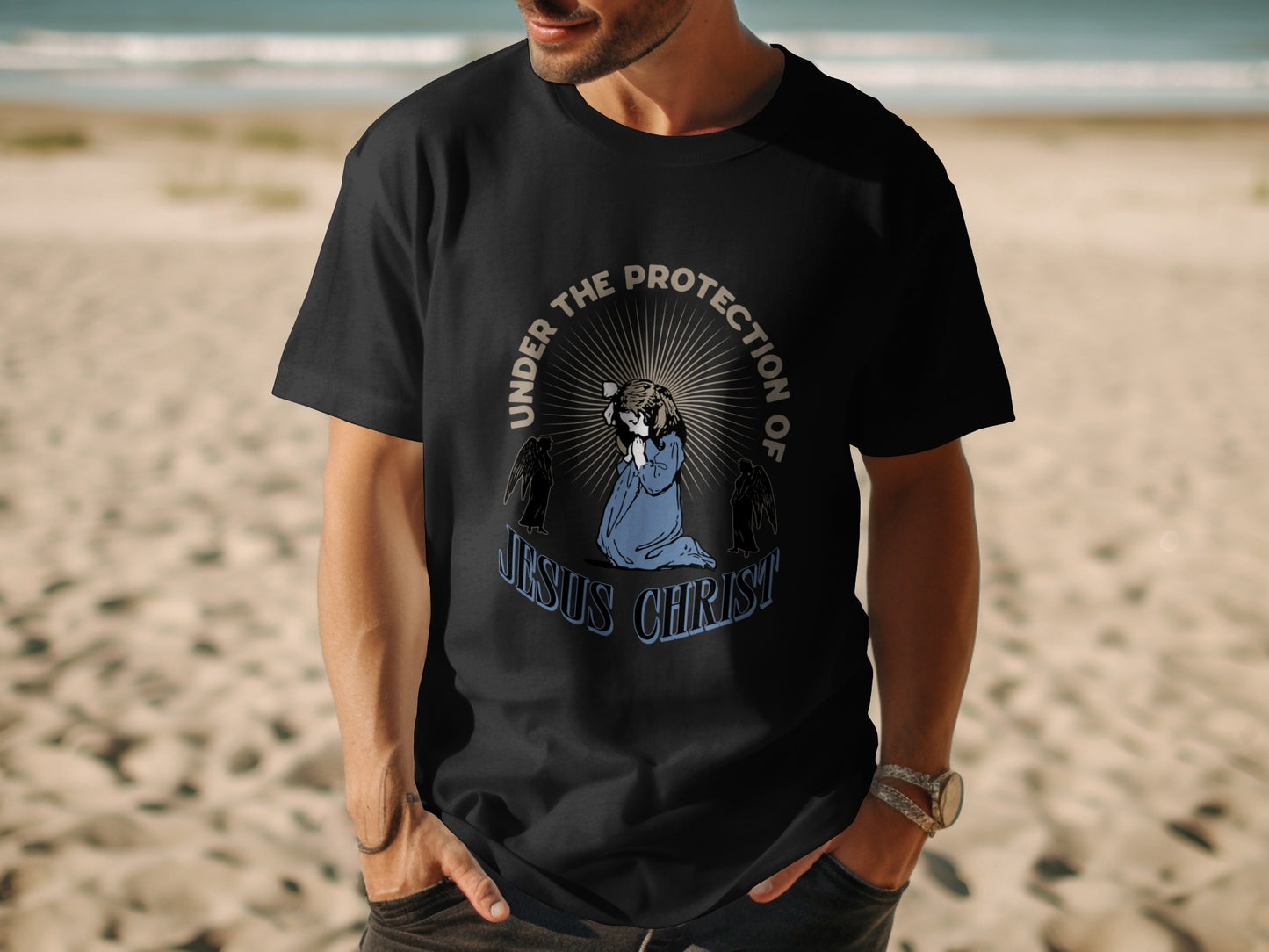 Black t-shirt featuring praying figure with "Under the Protection of Jesus Christ" text.