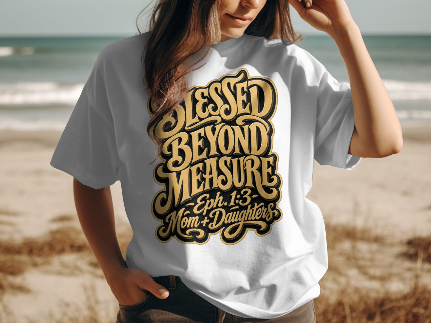 White t-shirt with black and gold text that reads "Blessed Beyond Measure - Eph. 1:3 - Mom + Daughters".