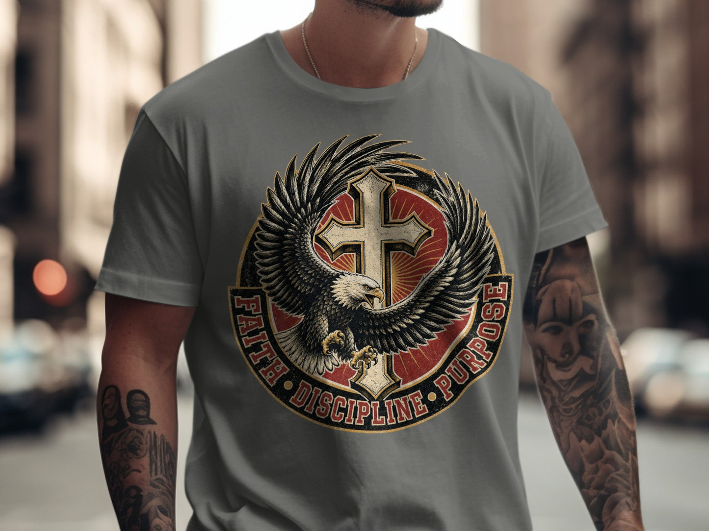 Eagle and cross graphic with text "Faith Discipline Purpose" on a grey t-shirt.