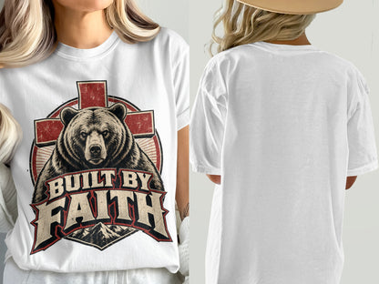 White t-shirt with a distressed graphic of a bear and cross with text "Built by Faith".