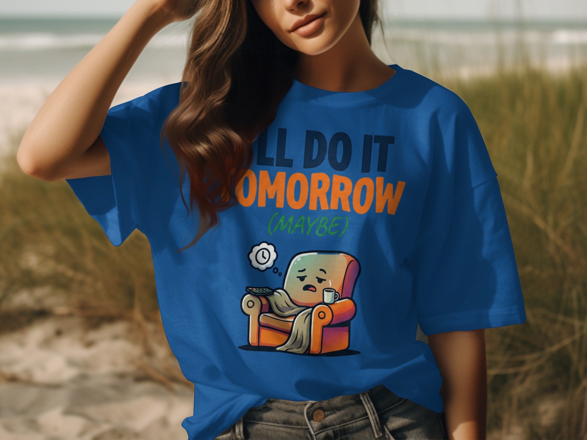 Blue t-shirt with "I’LL DO IT TOMORROW (MAYBE)" text and lazy armchair graphic.