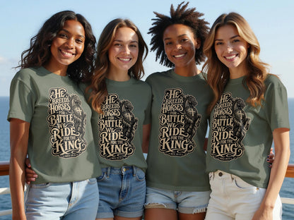 Four women smile, wearing olive green t-shirts with "He Breeds Horses For Battle" graphic.