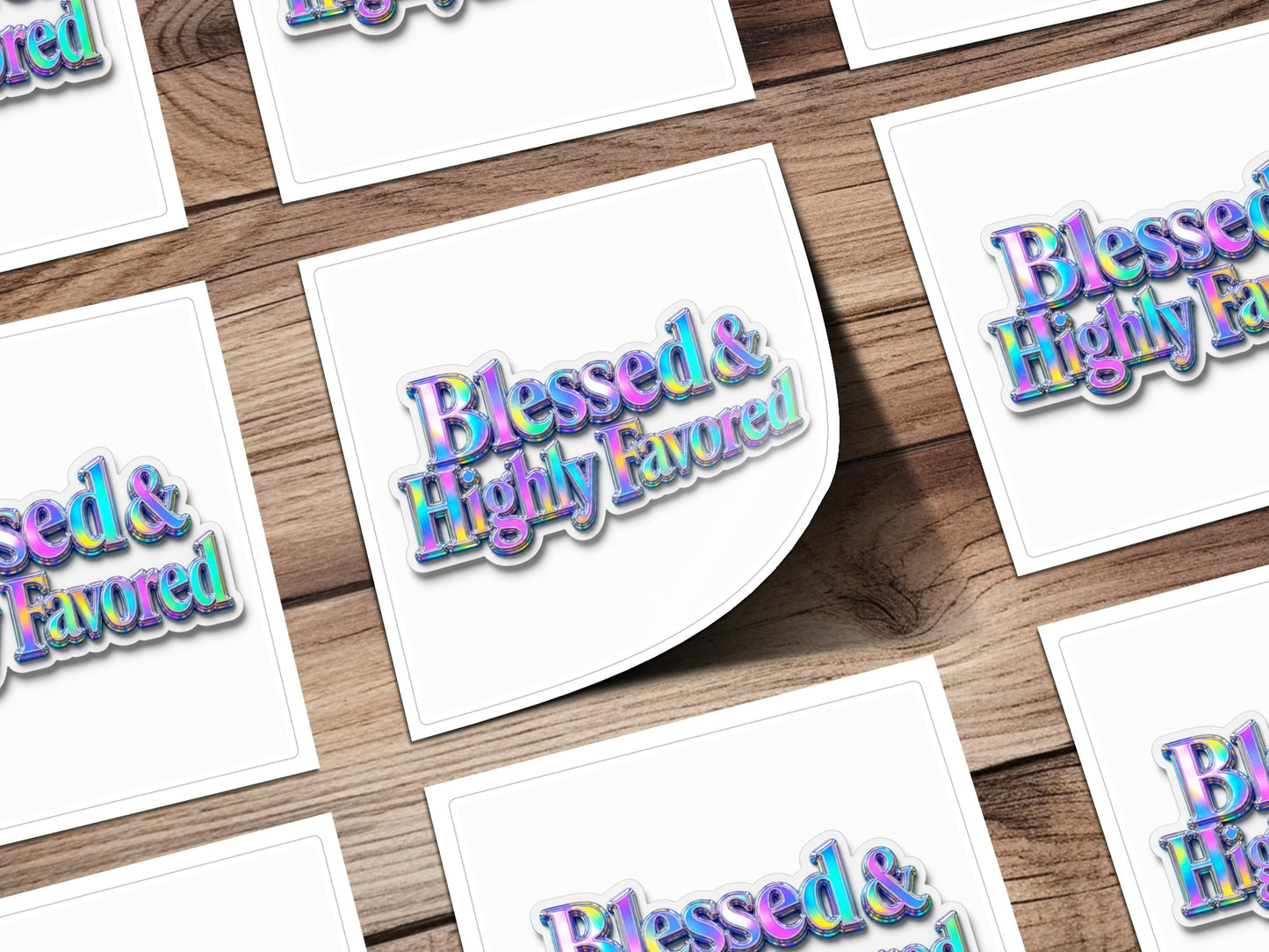 Blessed & Highly Favored text on multiple white square cards arranged on a wooden surface.