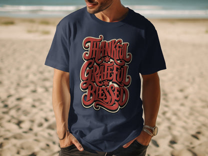 Navy t-shirt with "Thankful Grateful Blessed" in ornate red lettering.