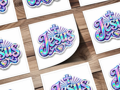 Holographic "Jesus" text with cross and heart on white cards.