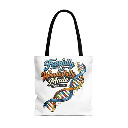 White tote bag with "Fearfully & Wonderfully Made" text and DNA graphic.