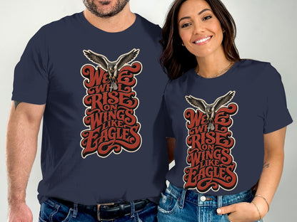 Dark navy t-shirts with "We Will Rise on Wings Like Eagles" text and eagle graphic.