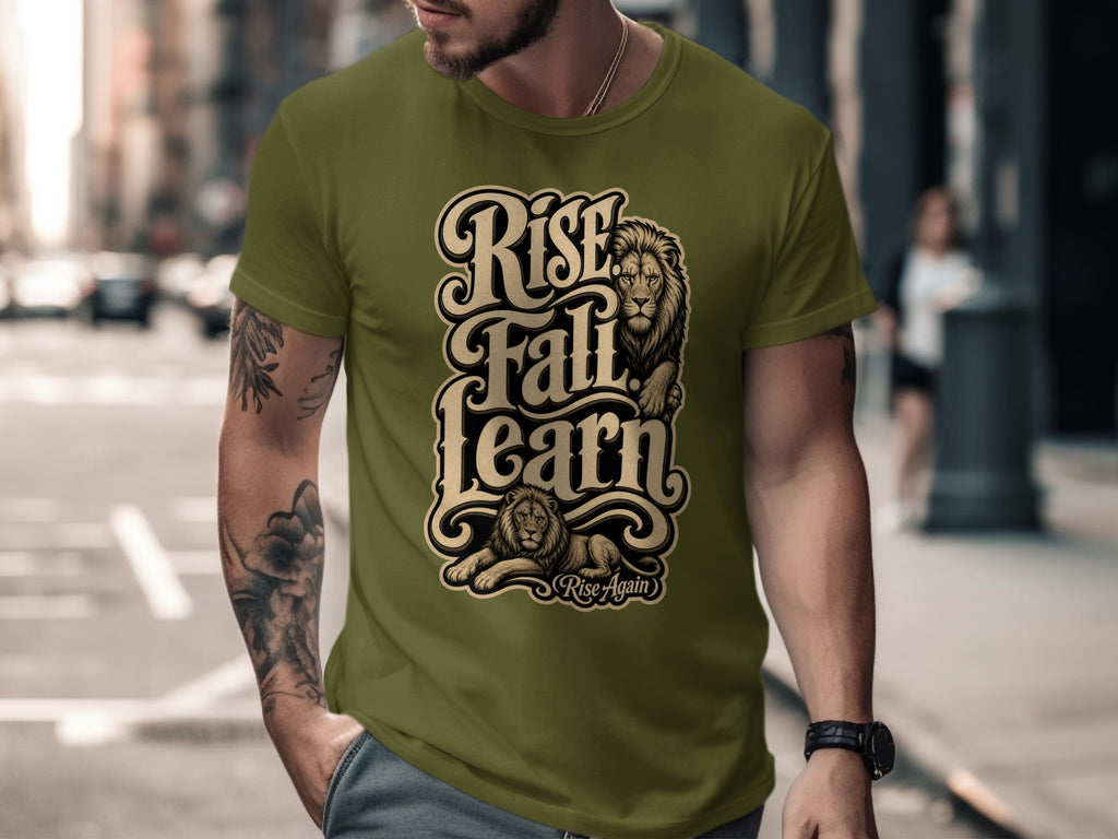 Olive green t-shirt with black and gold text "Rise Fall Learn" and two lions, "Rise Again".