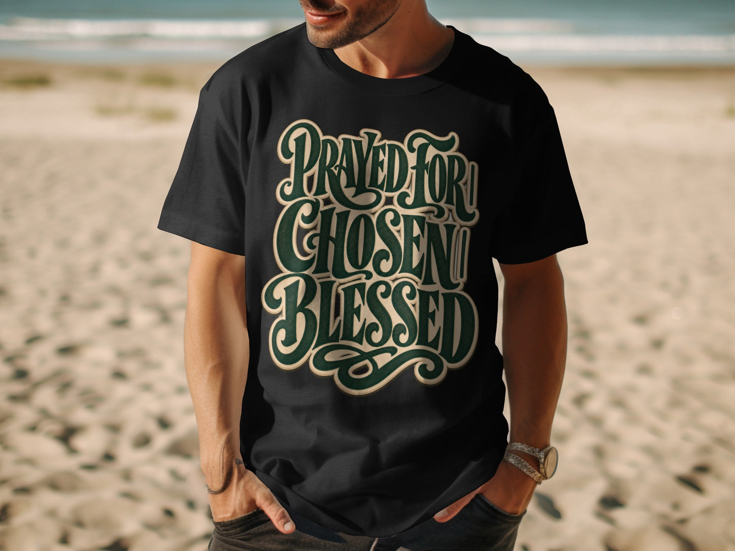 Black t-shirt with "Prayed For, Chosen, Blessed" in stylized green and cream text.