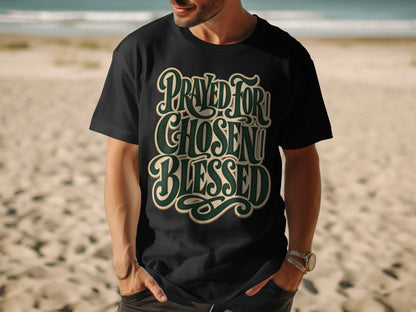 Black t-shirt with "Prayed For, Chosen, Blessed" in stylized green and cream text.