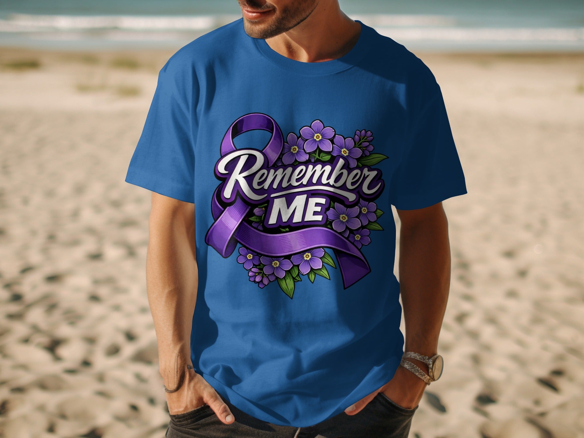 Blue t-shirt with purple ribbon and flowers graphic that reads "Remember ME."