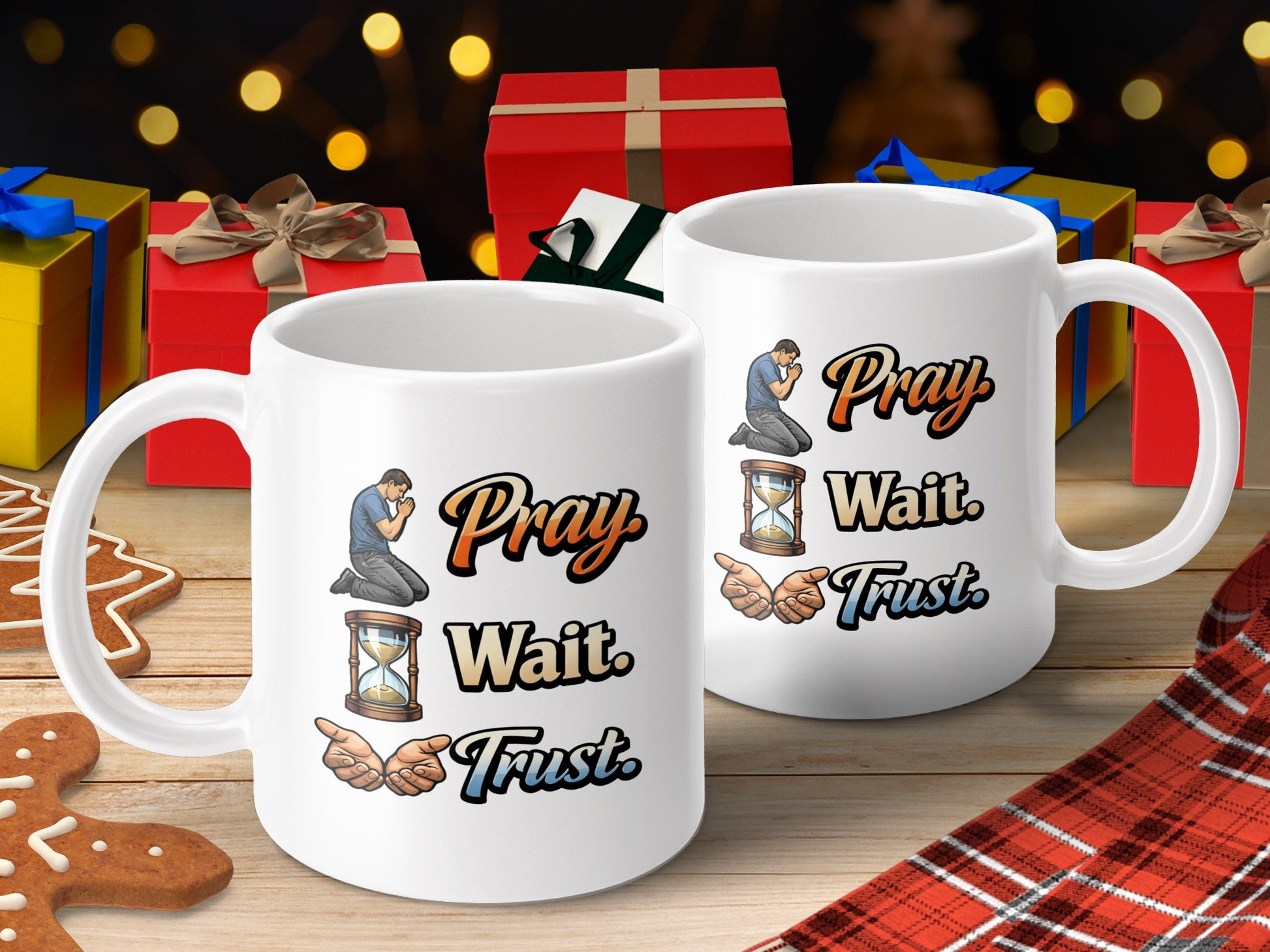 White mugs with "Pray Wait Trust" text and illustrations on wooden surface with gifts.