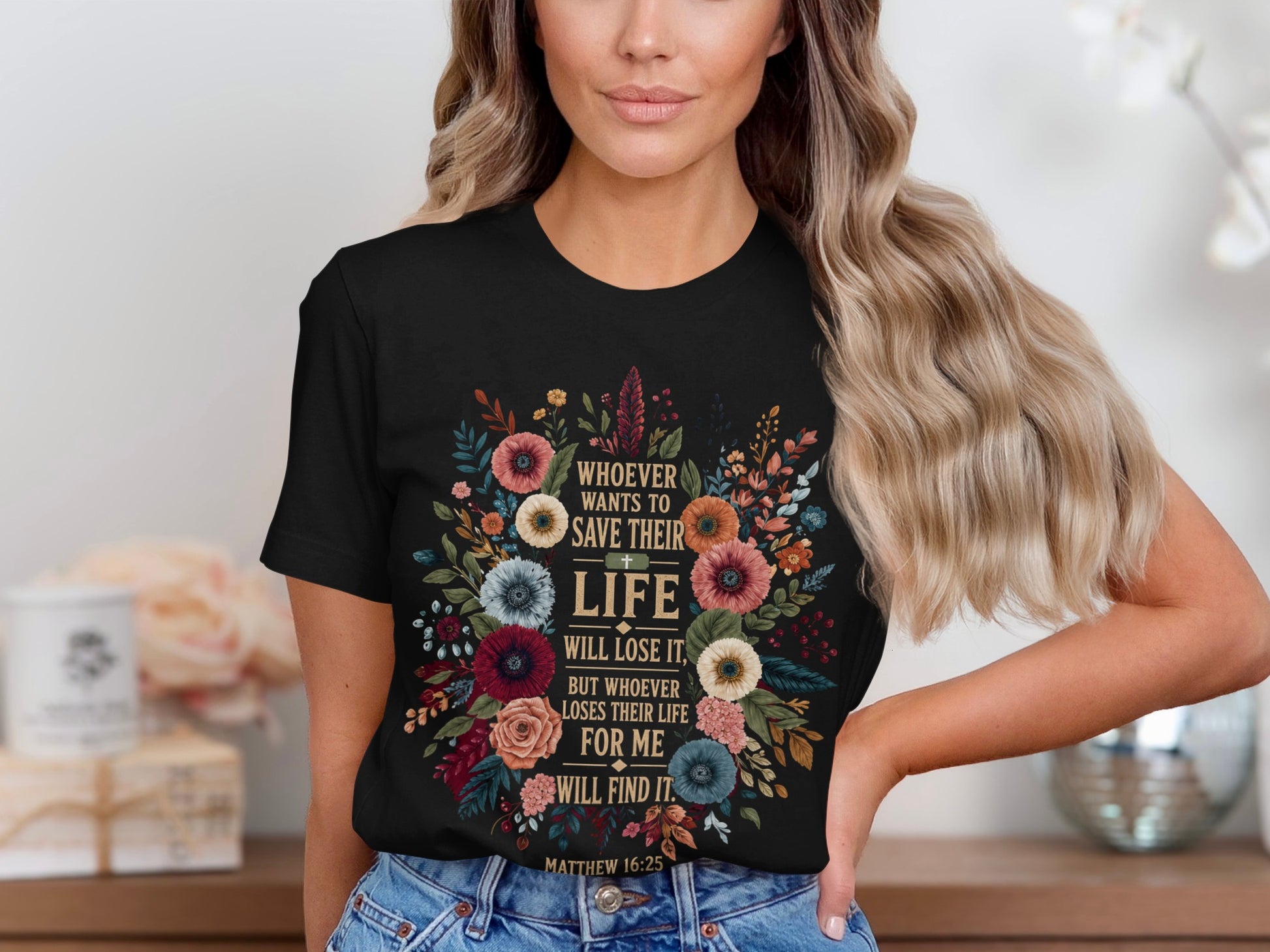 Black t-shirt with floral design and Bible verse "Whoever wants to save their life will lose it."