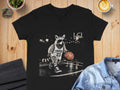 Black t-shirt with raccoon in sunglasses playing basketball, text "TRASH 23".