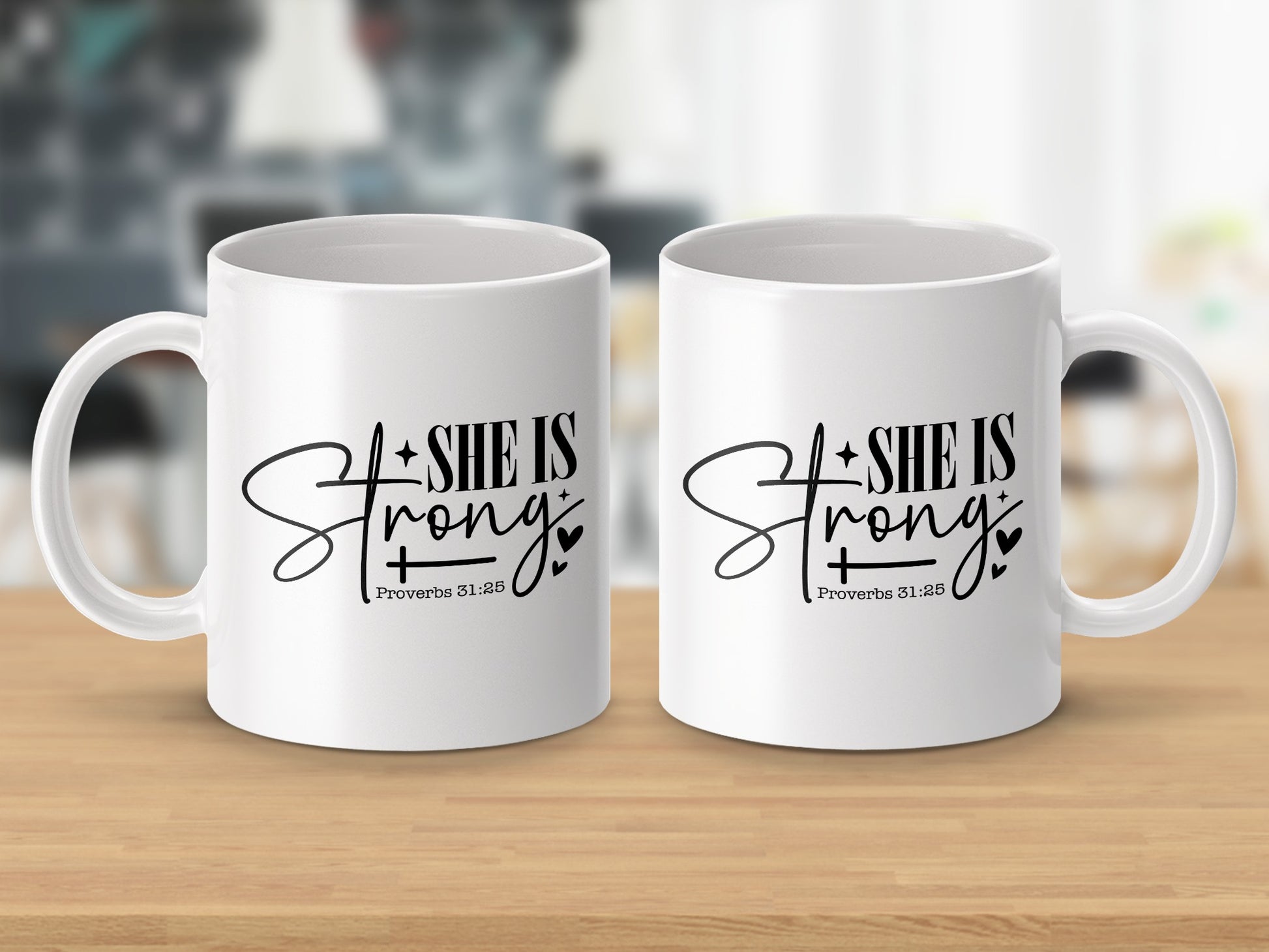 Two white mugs feature black script text reading "SHE IS Strong" and "Proverbs 31:25".