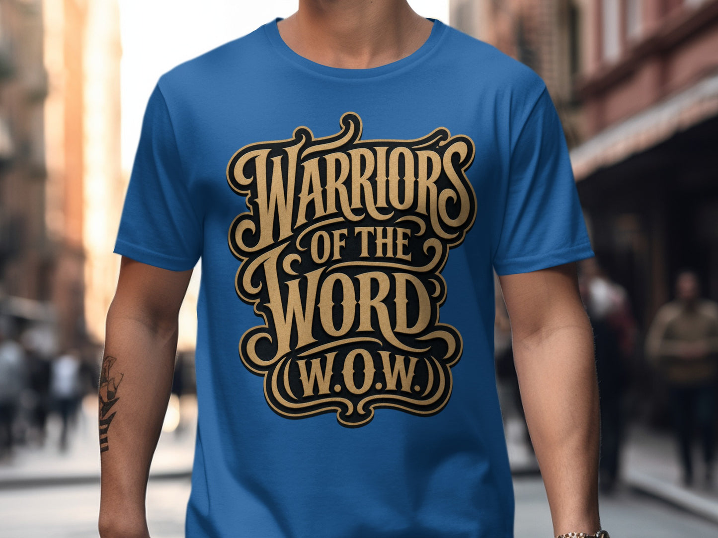 Blue t-shirt with gold and black text reading "Warriors of the Word (W.O.W.)".