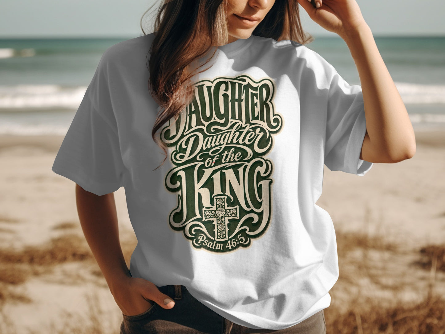 White t-shirt with "Daughter of the King" text and a cross.