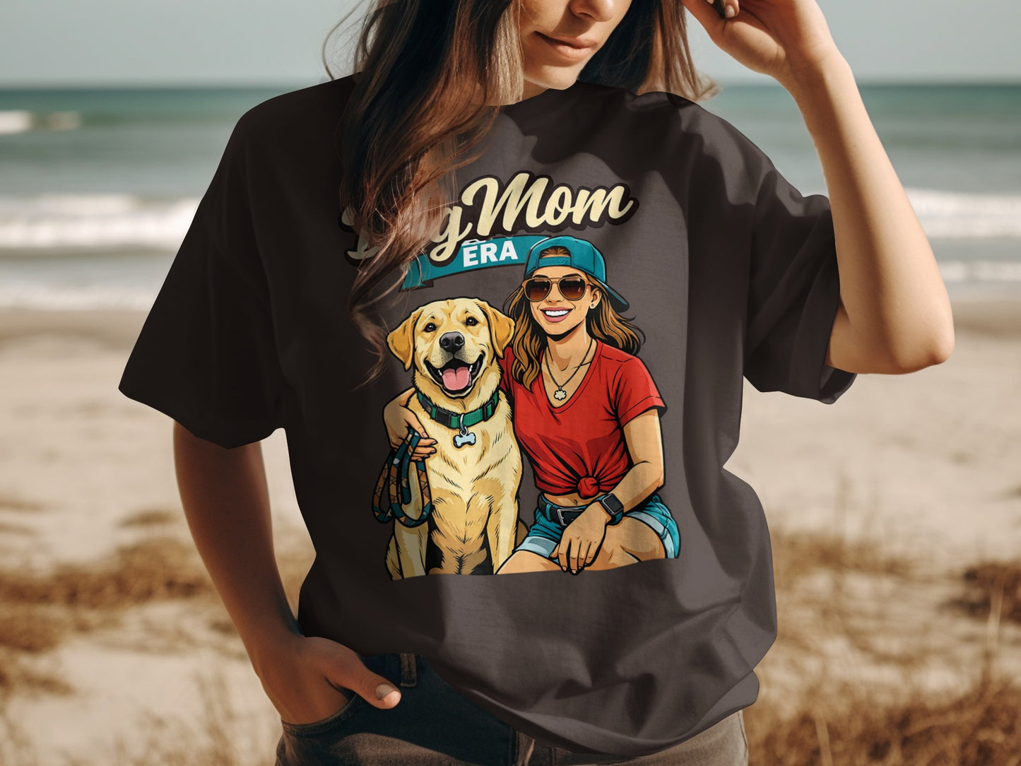 Dog Mom Era graphic with woman and golden retriever on dark t-shirt.