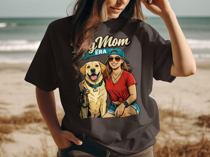 Dog Mom Era graphic with woman and golden retriever on dark t-shirt.