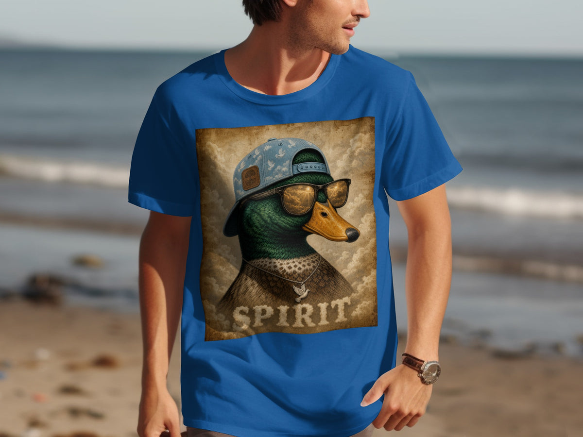 Dressed duck with sunglasses and baseball cap on blue t-shirt, text "SPIRIT" below.