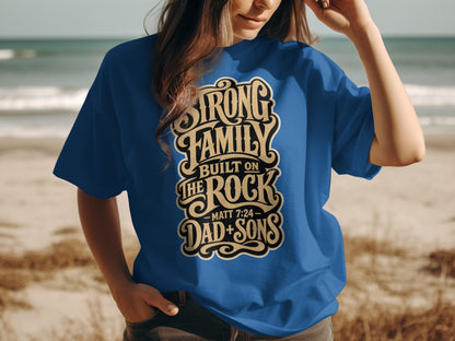 Blue t-shirt with "Strong Family Built on The Rock Dad + Sons" text.