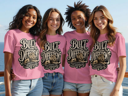 Four women in pink t-shirts with a lion graphic and text "Built Different".