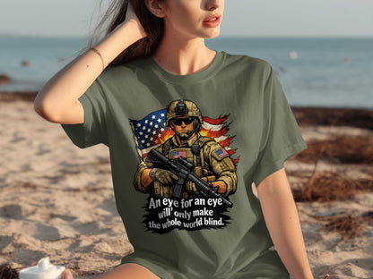 Green t-shirt with soldier, American flag, and text: "An eye for an eye will only make the whole world blind."