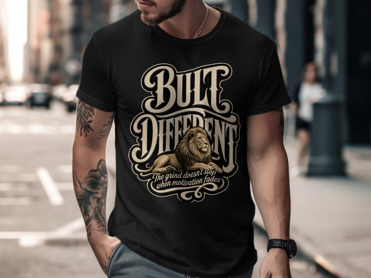 Black t-shirt with "BUILT DIFFERENT" text, lion illustration, and motivational quote.
