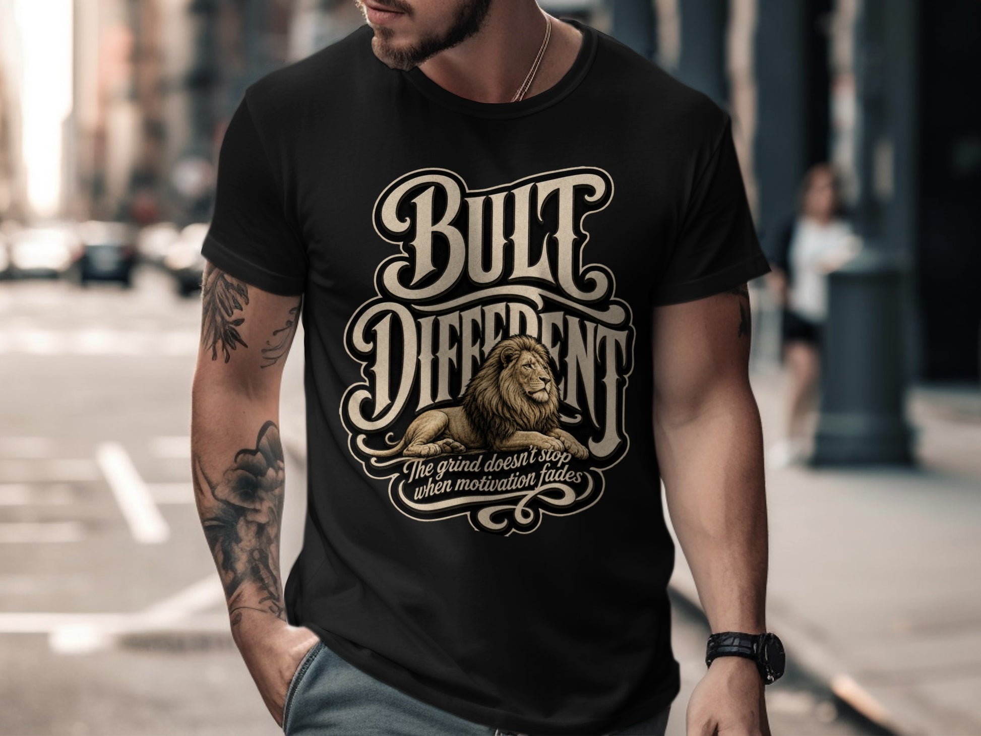 Black t-shirt with "BUILT DIFFERENT" text, lion illustration, and motivational quote.