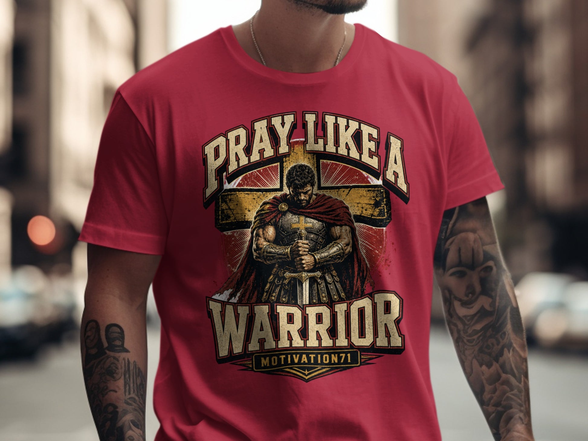 Red t-shirt with "PRAY LIKE A WARRIOR MOTIVATION71" design and warrior graphic.