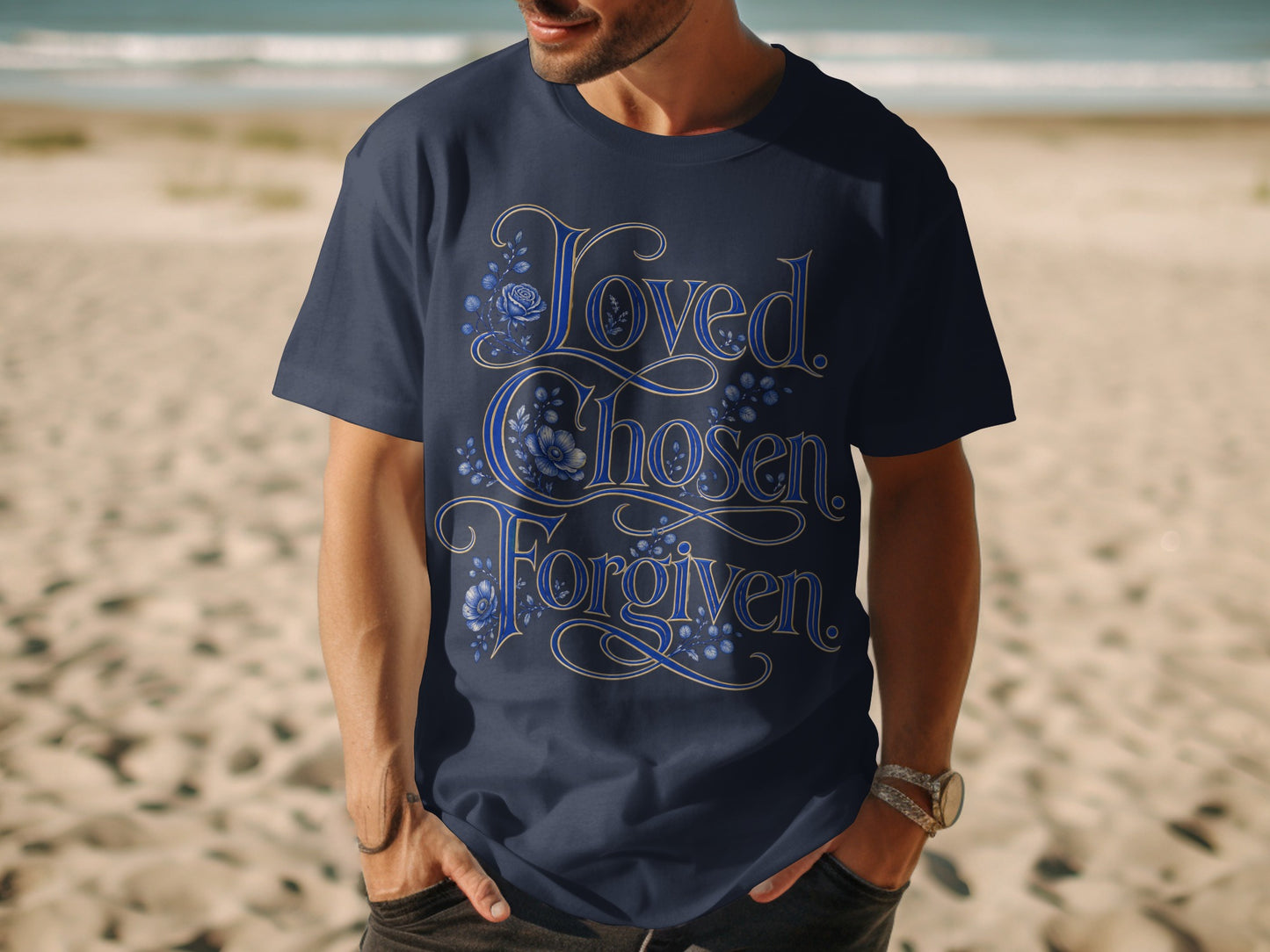 Dark blue t-shirt with "Loved. Chosen. Forgiven." text and floral designs.