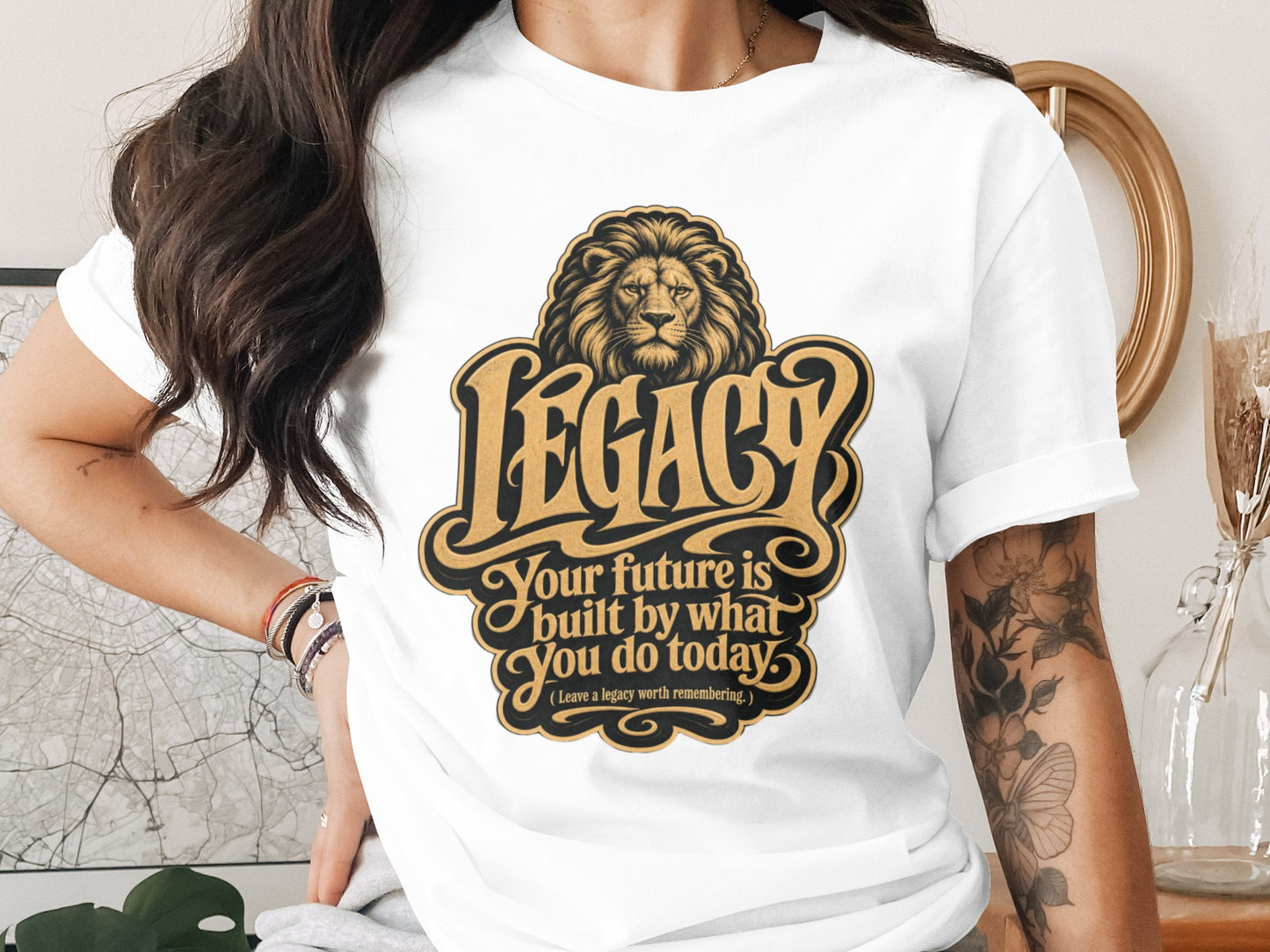White t-shirt with lion and "LEGACY" text design, motivational quote.