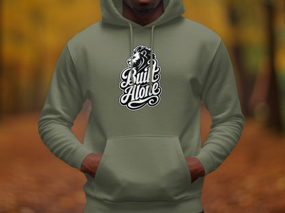 Olive green hoodie with a black and white lion and "Built Alone" text graphic.