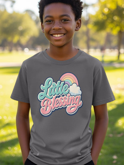 Boy wearing gray t-shirt with "Little Blessing" text and rainbow graphic.