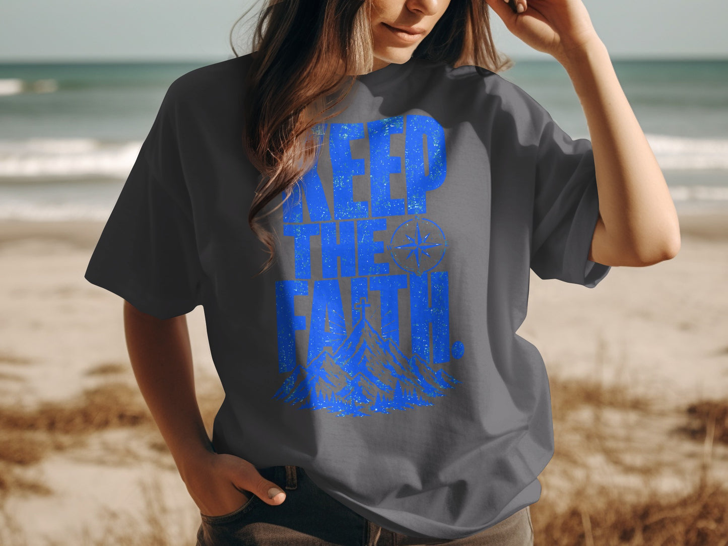 Dark gray t-shirt with blue "Keep the Faith" text and mountain graphic.