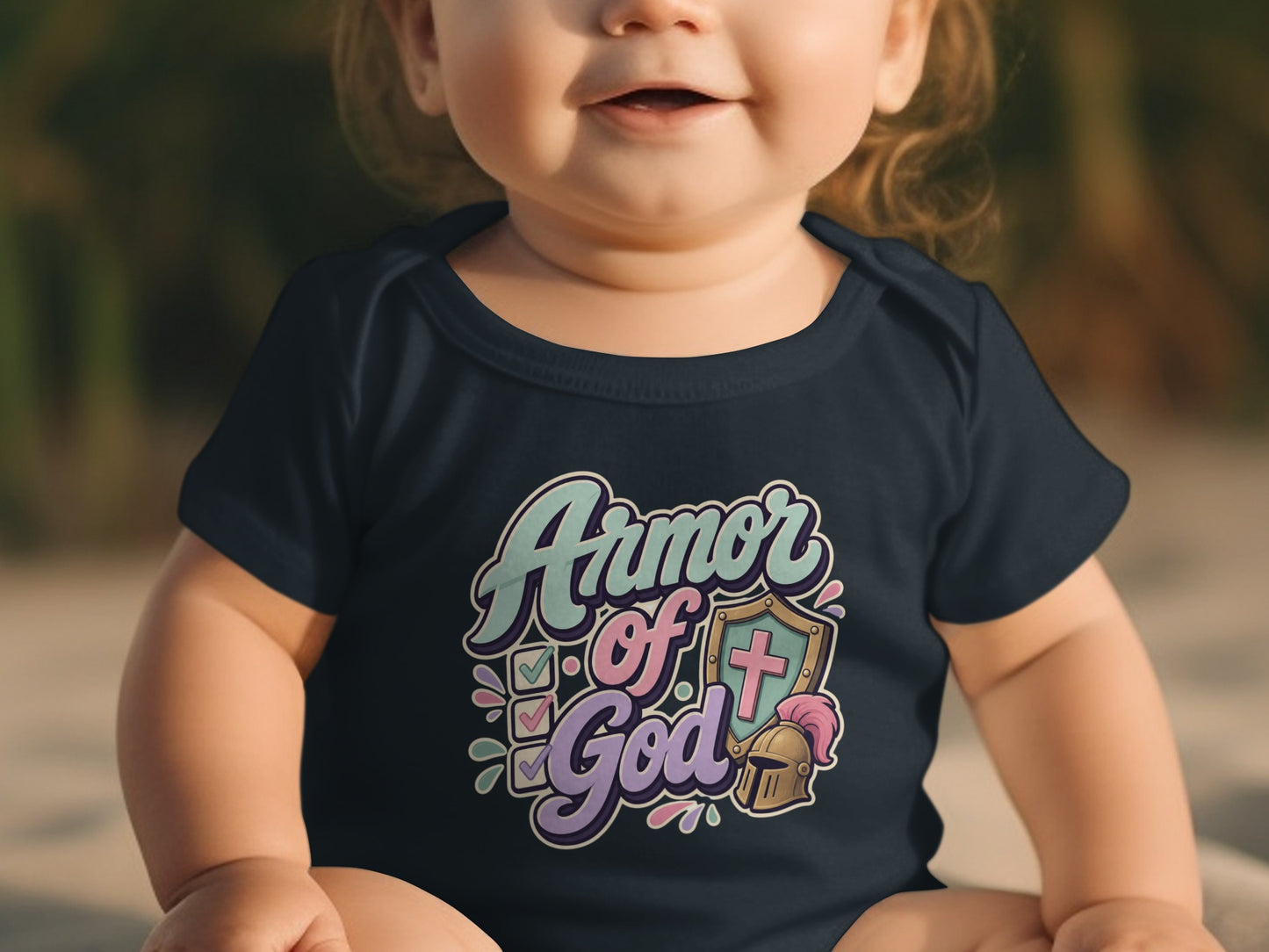 Baby wearing navy bodysuit with "Armor of God" graphic featuring shield, helmet, and checkmarks.
