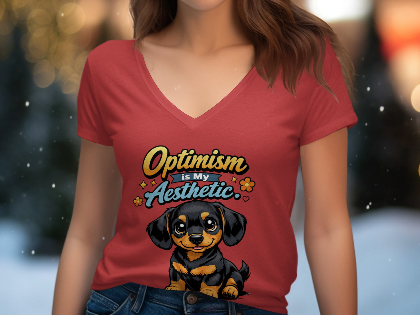 Red v-neck shirt with a smiling dachshund and "Optimism is My Aesthetic" text.