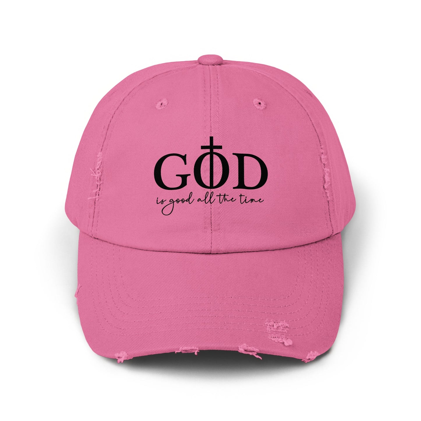 Distressed pink baseball cap with "GOD is good all the time" text and cross.